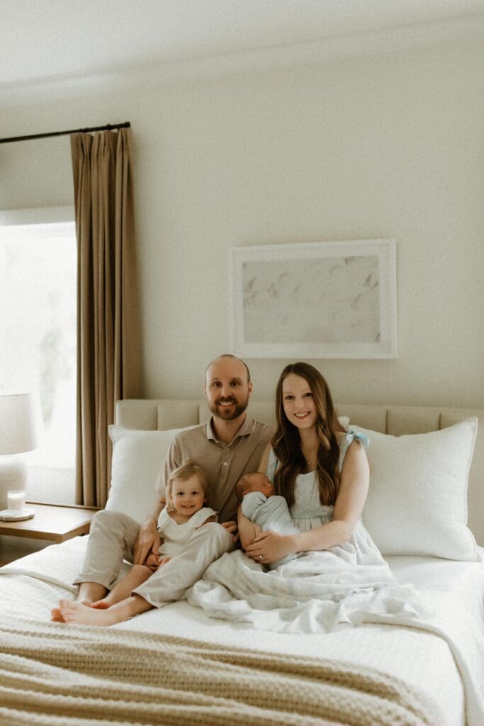 photo of a family posing with newborn baby in south bend photo session
