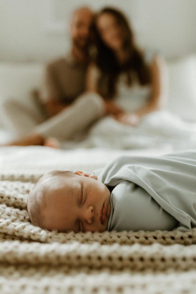 baby boy sleeping during newborn photoshoot