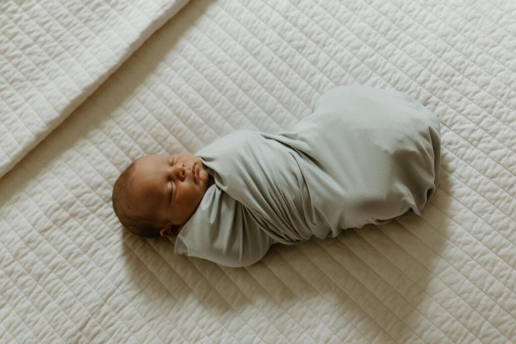south bend newborn photographers photo of a baby boy on bed