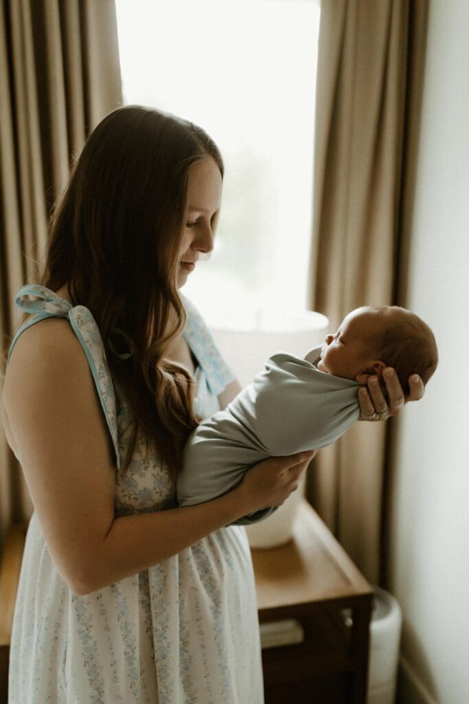 portrait of a mother and newborn baby in home setting 