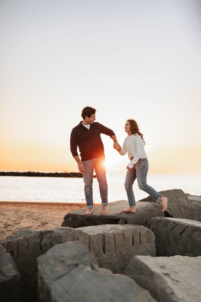photo of couple on rocks in new buffalo michigan