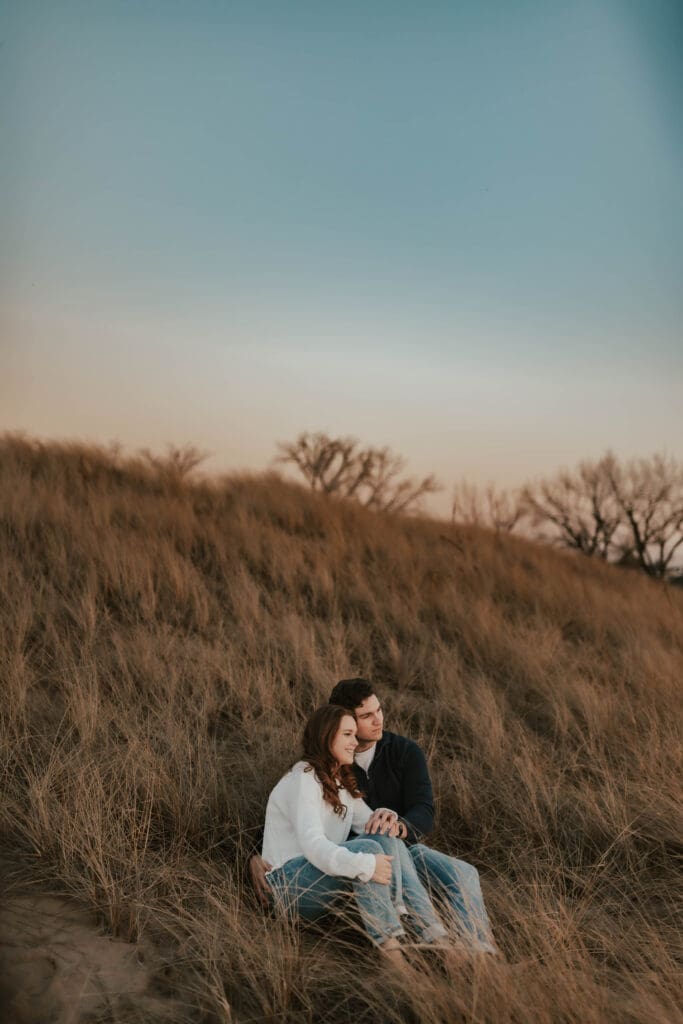 couple watching new buffalo michigan sunset