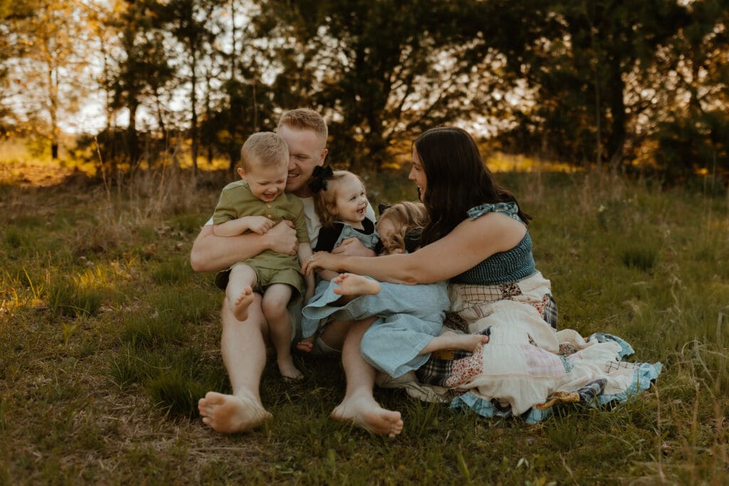 mom and dad laughing with kids during Granger Indiana family photos