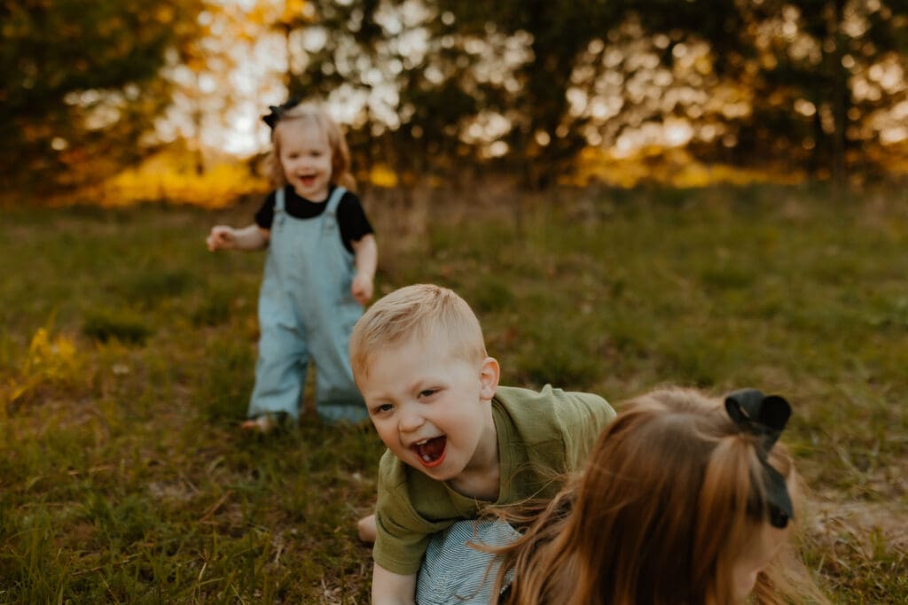 toddler running during family session at Cobus Creek County Park