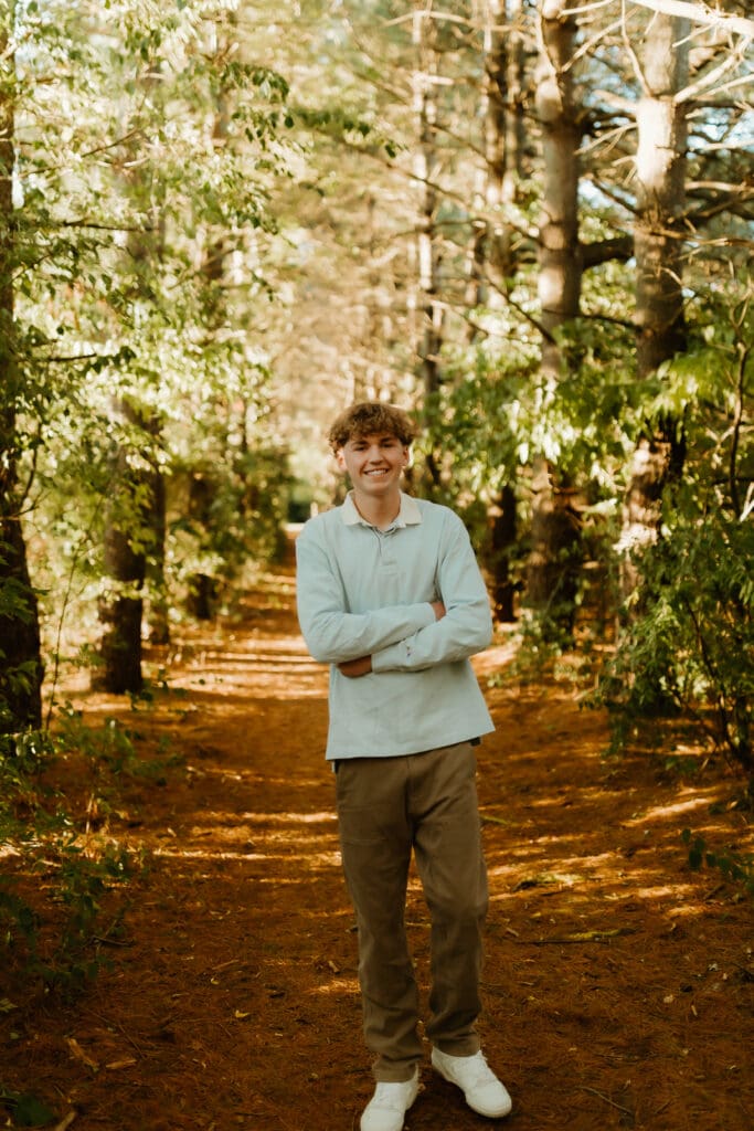 senior photograph at st patrick's county park in the trees