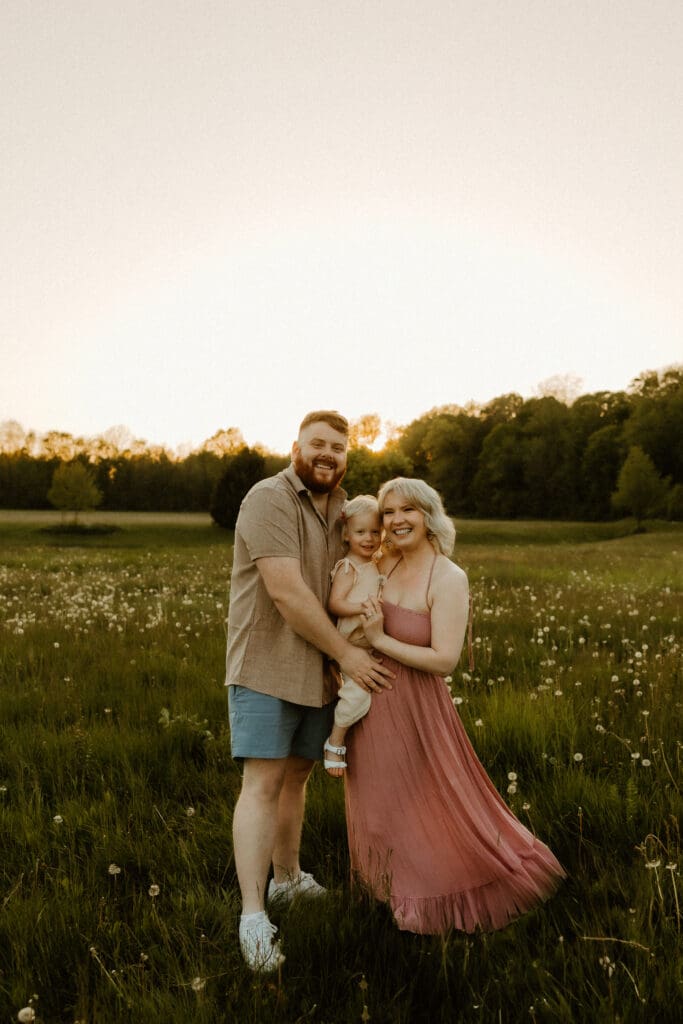 family photo session in an open field during south bend golden hour