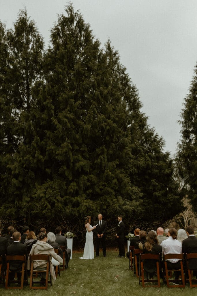 small garden wedding ceremony with guests in michigan