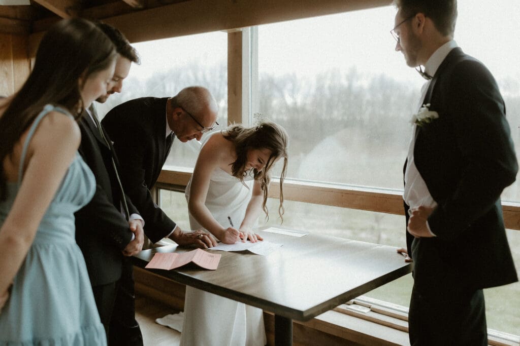 wedding dinner at tabor hill winery michigan couple signing certificate