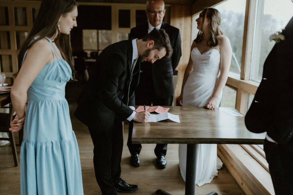 photography of groom during wedding dinner in buchanan michigan