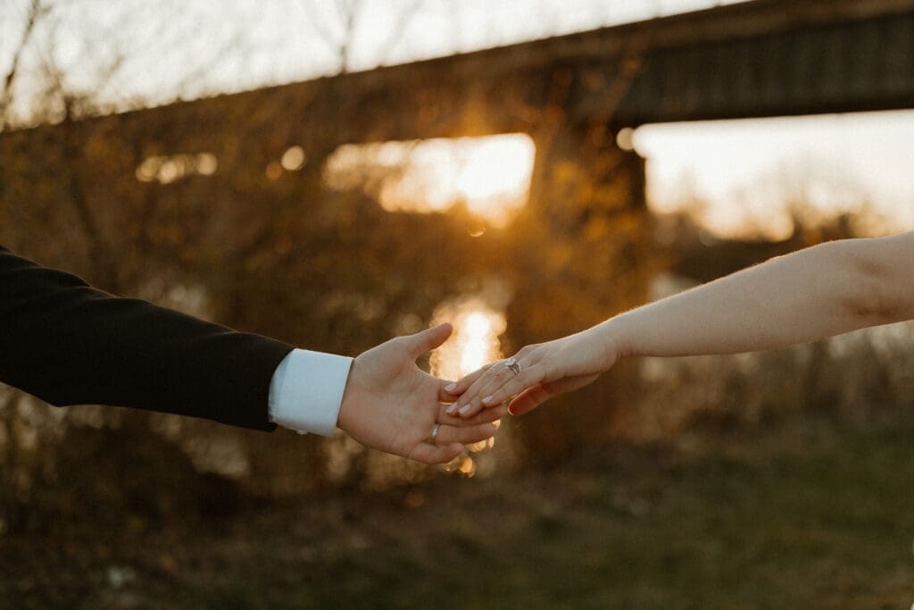 detail shot of wedding rings on hands