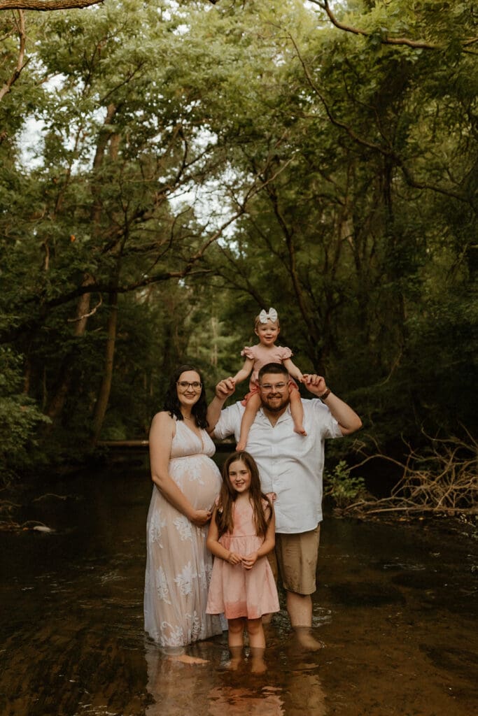 family photo in a creek setting during lifestyle photo session