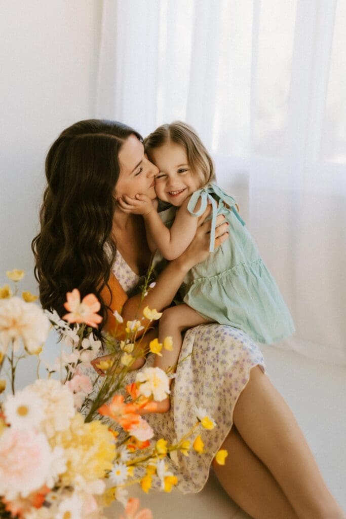 mommy and me photography in studio setting with flowers