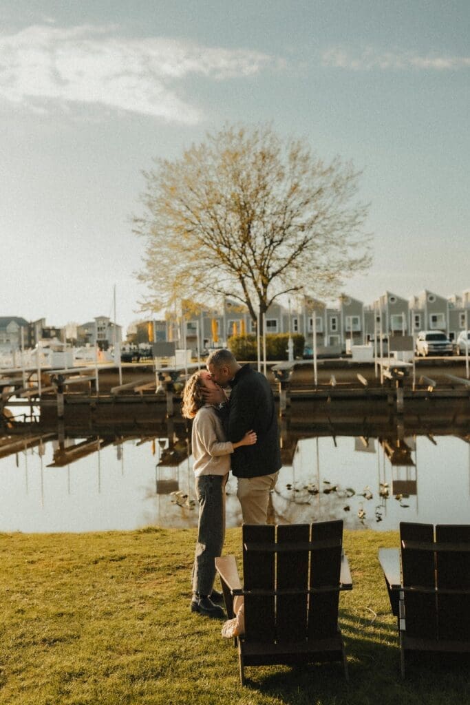 Couple kissing to celebrate engagement after proposal 