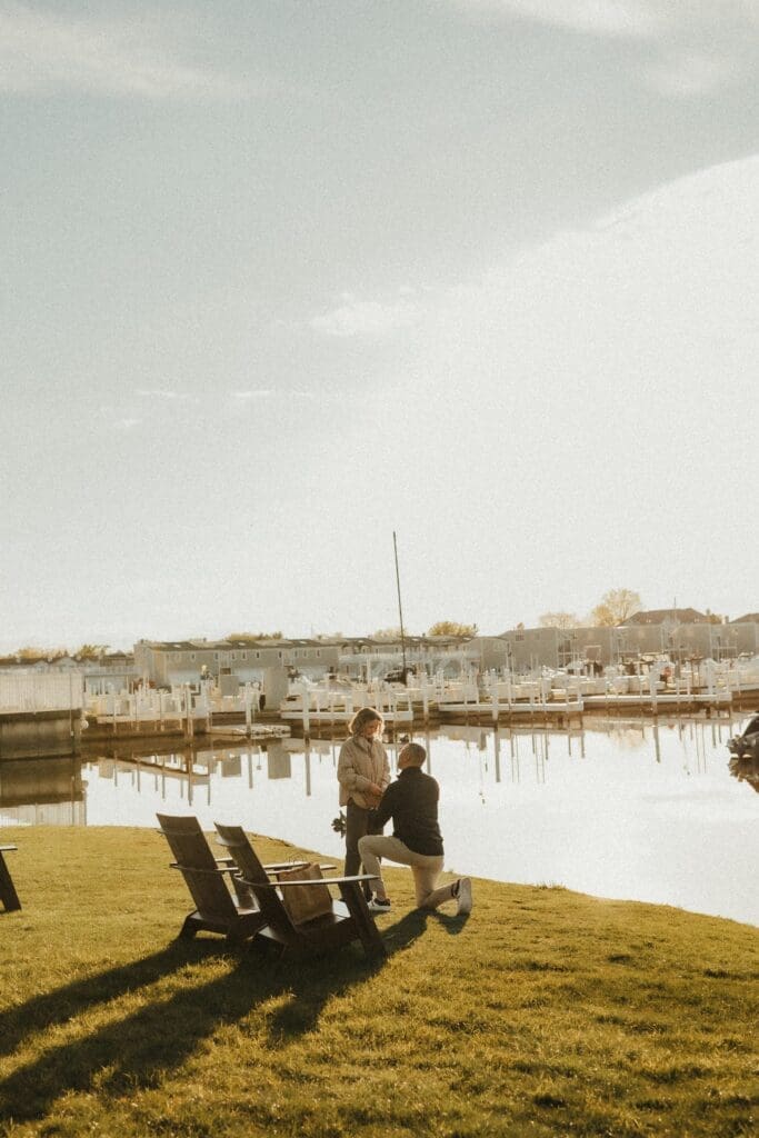new buffalo michigan proposal photographer captures lakeside moment with man down on one knee popping the question