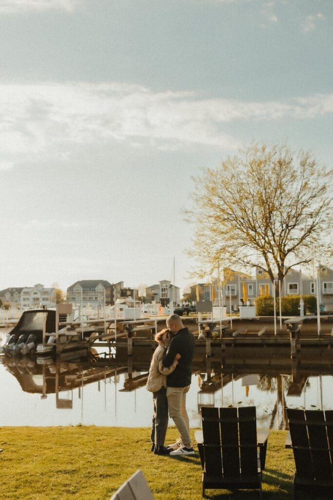 newly engaged couple after proposal hugging