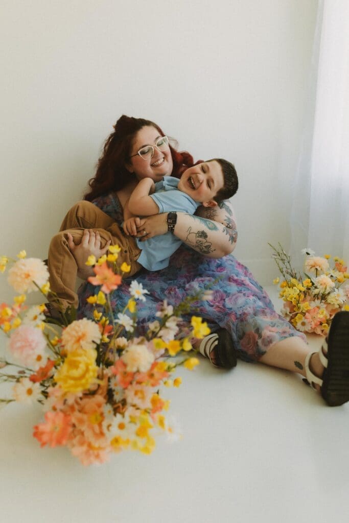mom and son giggling in photography studio