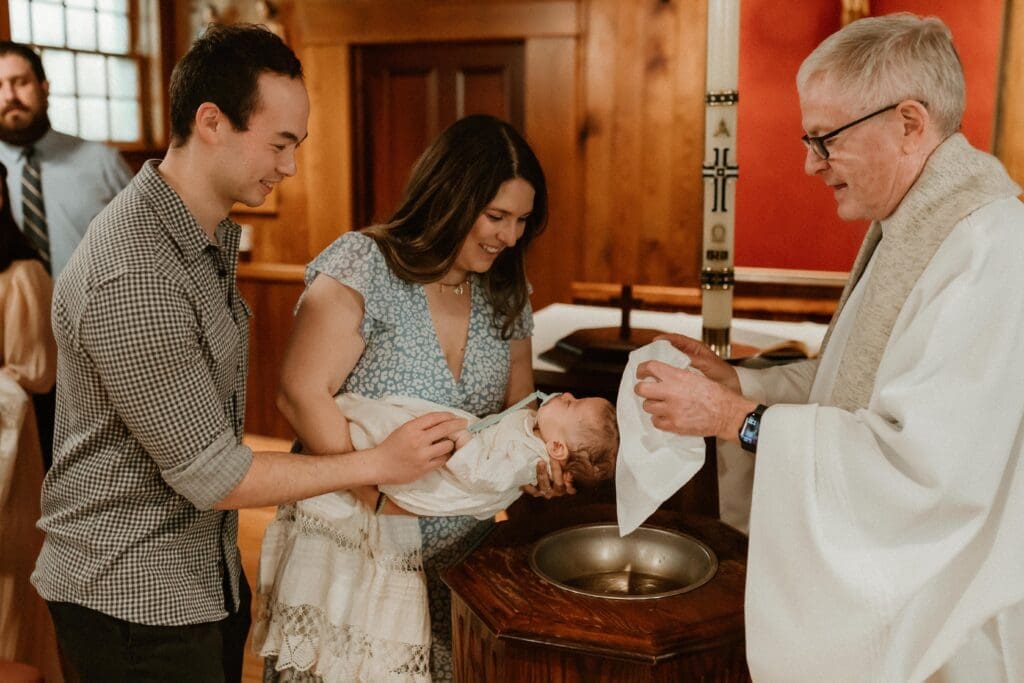 Catholic baptism ceremony at the Log Chapel at Notre Dame
