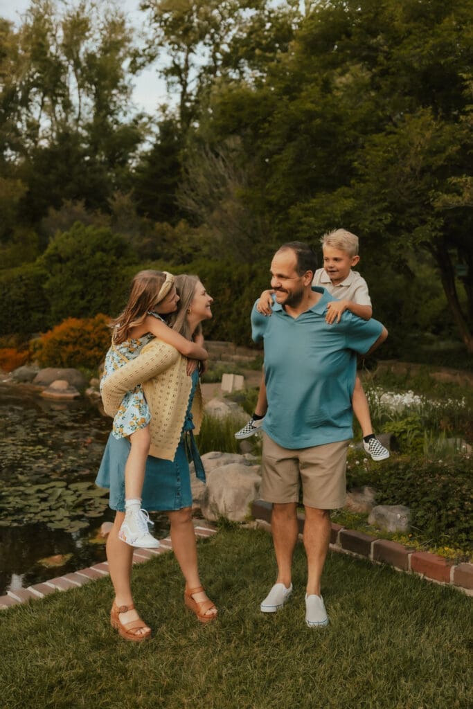 candid family photo by pond at defries garden