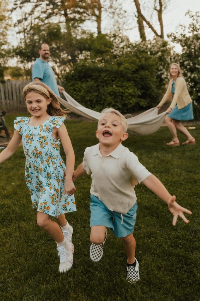 captured by elkhart family photographer, candid moment between parents and children