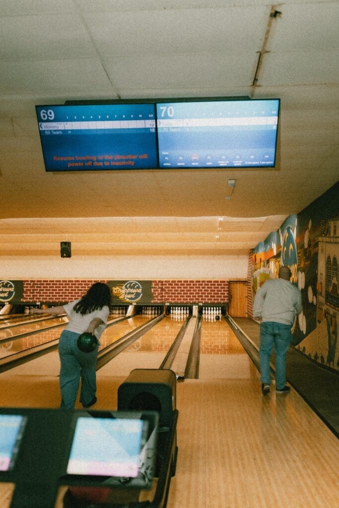 engaged couple bowling together in south bend bowling alley