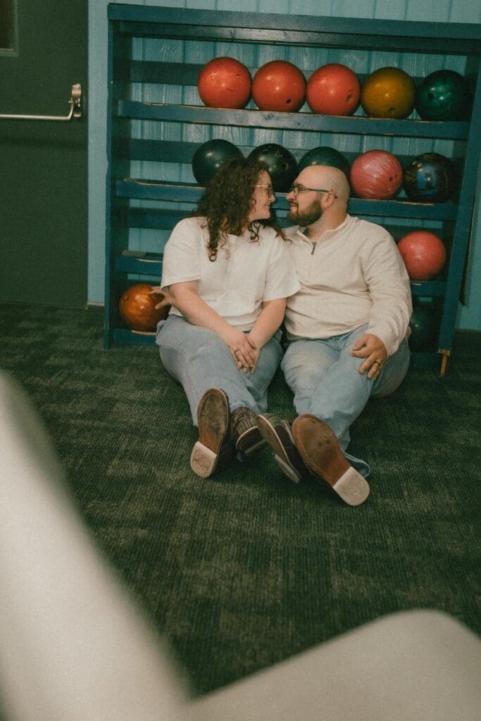 south bend engagement photographer captures sweet photos inside bowling alley