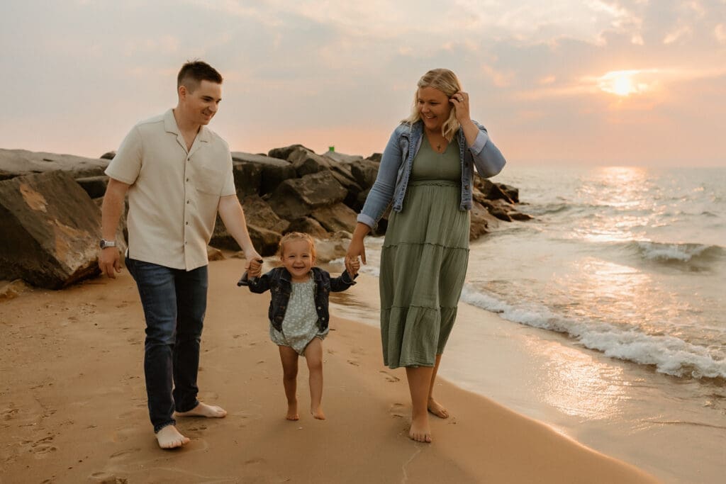 family walking along the beach in south haven